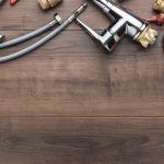 Top View Photo Of Plumbing Tools Over Wooden Background With Copy Space